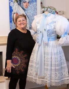 Woman with a blue and white traditional Slovak wedding costume in the style of the village of Láb